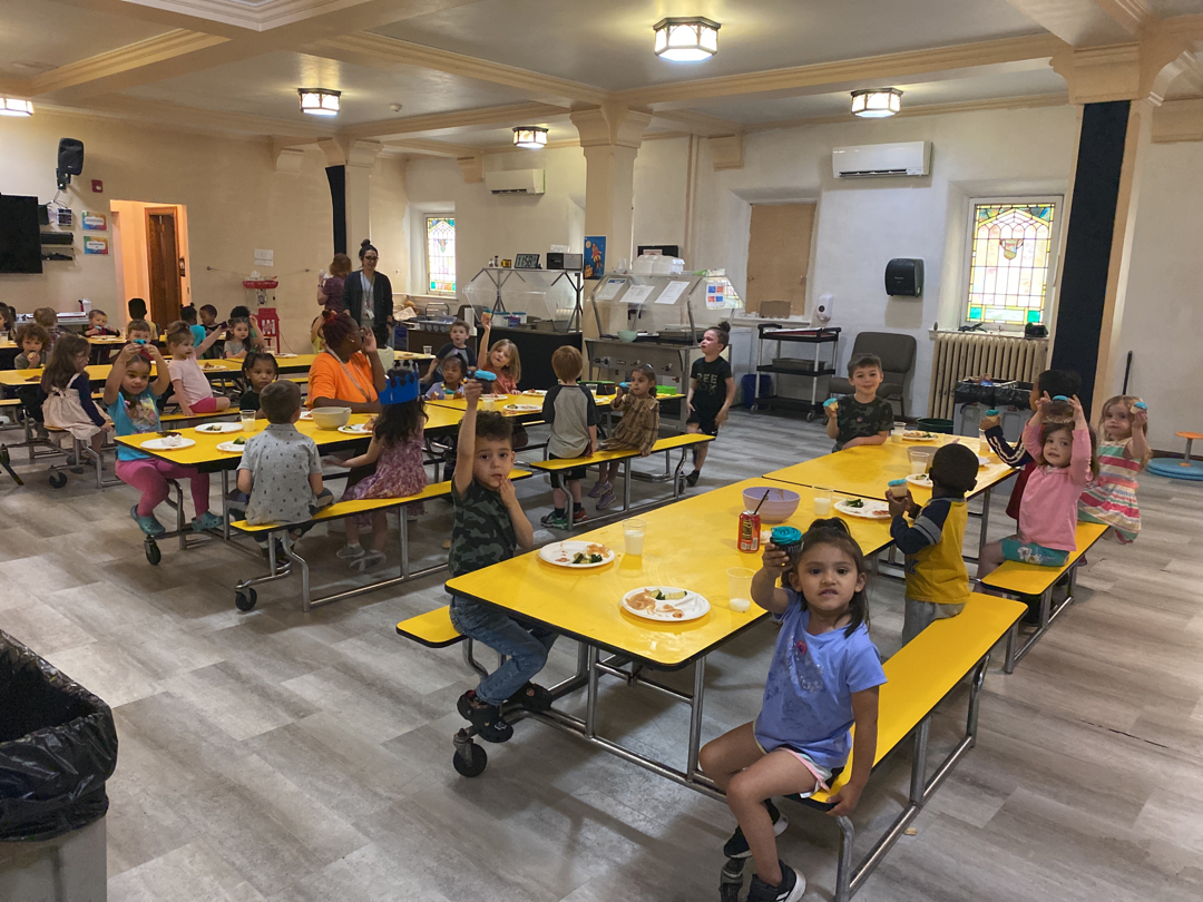Children gathered for a meal at Brookline Sprouts
