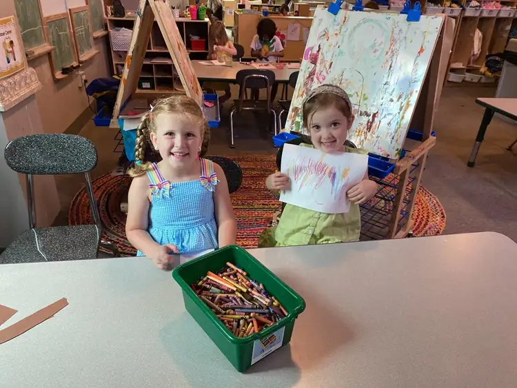 Children enjoying summer classroom craft activity