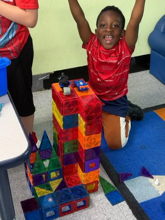 Children building with magnablocks