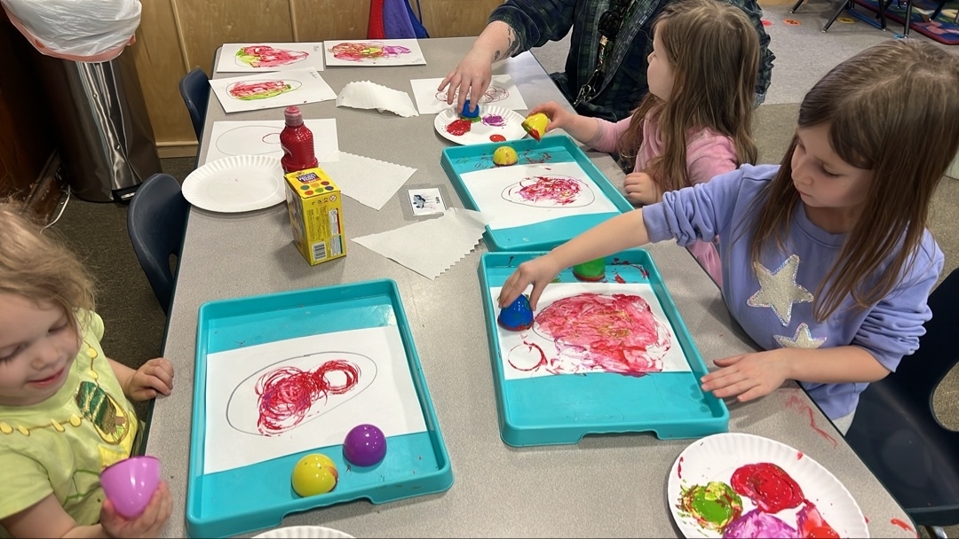 Preschool child painting during craft time