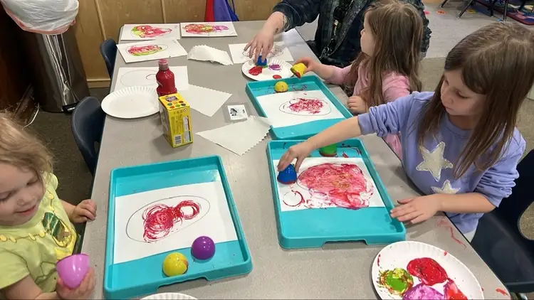Preschool child painting during craft time