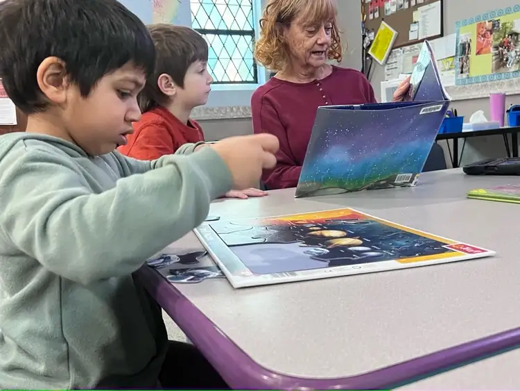 Child exploring a classroom station