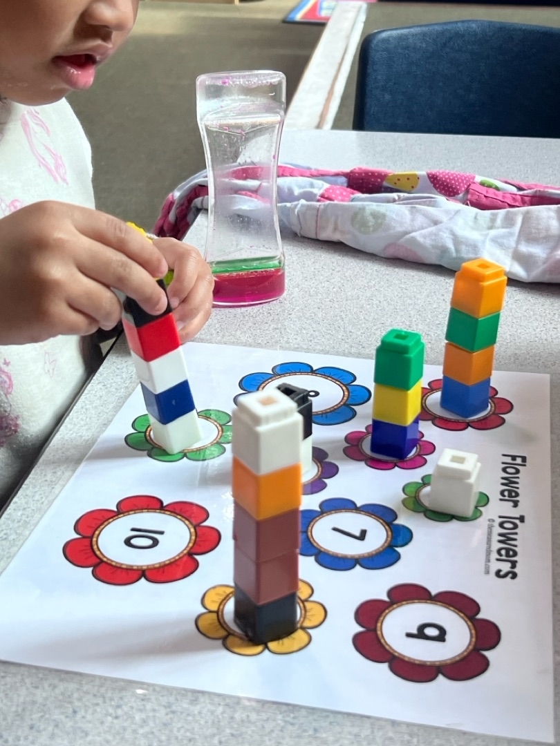 Child working with classroom learning materials at Brookline Sprouts