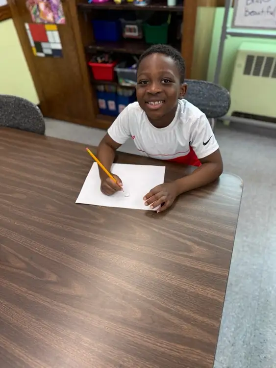 School age child working independently